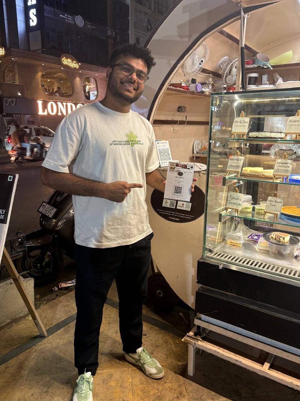 A customer scanning the Retenly QR at Hey Cheese